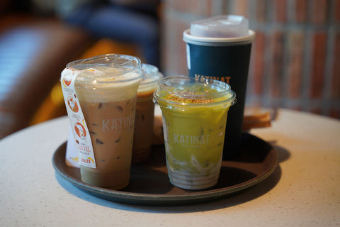 Close-up of various iced drinks on a cafe table. Perfect for beverage or cafe-themed projects.